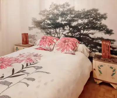 Un ou plusieurs lits dans un hébergement de l'établissement Maison charmante à La Flèche avec jardin et parking privé