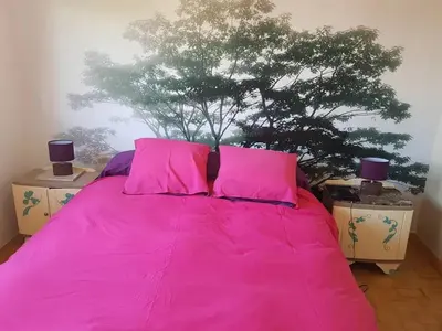 Un ou plusieurs lits dans un hébergement de l'établissement Maison charmante à La Flèche avec jardin et parking privé