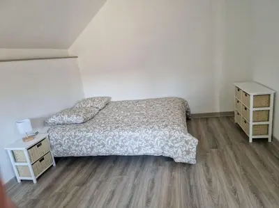 Un ou plusieurs lits dans un hébergement de l'établissement Appartement au milieu des vignes