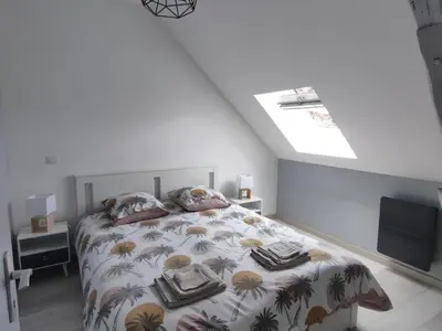 Un ou plusieurs lits dans un hébergement de l'établissement Gîte de charme avec piscine, terrasse et jardin dans la vallée du Loir - FR-1-491-381
