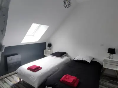 Un ou plusieurs lits dans un hébergement de l'établissement Gîte de charme avec piscine, terrasse et jardin dans la vallée du Loir - FR-1-491-381