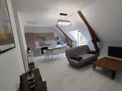 Coin salon dans l'établissement Gîte de charme avec piscine, terrasse et jardin dans la vallée du Loir - FR-1-491-381