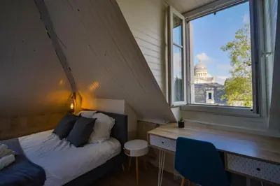 Un ou plusieurs lits dans un hébergement de l'établissement Le Saint-Martin - Hypercentre - Netflix