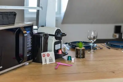 Cuisine ou kitchenette dans l'établissement Le Saint-Martin - Hypercentre - Netflix