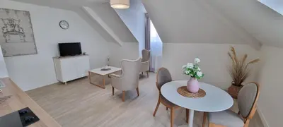 Télévision ou salle de divertissement dans l'établissement Résidence de Châtelleraut