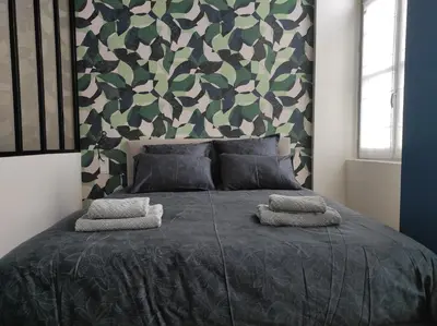 Un ou plusieurs lits dans un hébergement de l'établissement Appartement Quai Abbé Grégoire