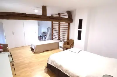 Un ou plusieurs lits dans un hébergement de l'établissement Maison chaleureuse