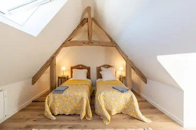 Un ou plusieurs lits dans un hébergement de l'établissement Le Puits Renaissance - Gîtes de caractère et piscine chauffée