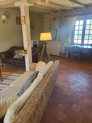 Coin salon dans l'établissement Gite Le Charme