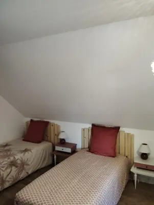 Un ou plusieurs lits dans un hébergement de l'établissement Superbe maison de famille