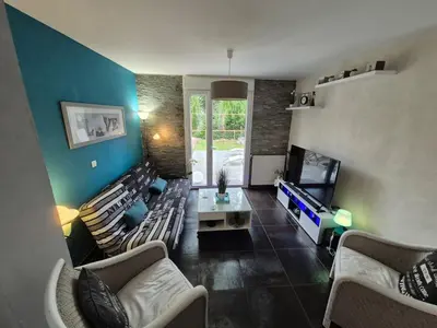 Coin salon dans l'établissement Maison d Angele 4 chambres