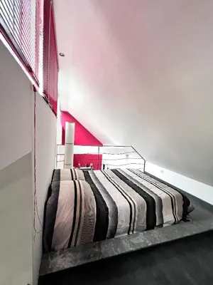 Un ou plusieurs lits dans un hébergement de l'établissement Maison à 5 minutes des 24H du Mans