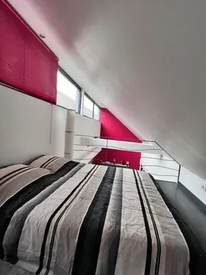 Un ou plusieurs lits dans un hébergement de l'établissement Maison à 5 minutes des 24H du Mans