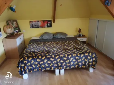 Un ou plusieurs lits dans un hébergement de l'établissement chambres d hôtes Coco