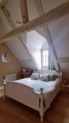 Un ou plusieurs lits dans un hébergement de l'établissement Duplex à colombages en bord de Loire à 2 pas du château de Blois