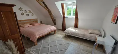 Un ou plusieurs lits dans un hébergement de l'établissement Gîte du bois Richer 4 étoiles 15 personnes avec piscine