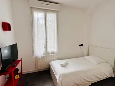 Un ou plusieurs lits dans un hébergement de l'établissement Lakanal 1 - Studio Prébendes Tours