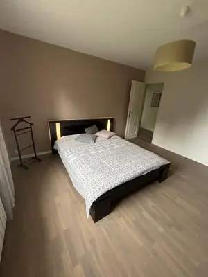 Un ou plusieurs lits dans un hébergement de l'établissement Charmante maison proche des 24h du Mans