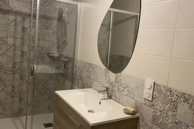Salle de bains dans l'établissement Le cocon du Faubourg