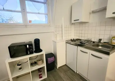 Cuisine ou kitchenette dans l'établissement 1# Central'Tours BLEU - Hypercentre