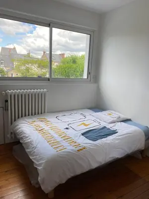 Un ou plusieurs lits dans un hébergement de l'établissement Chambres d’hôtes