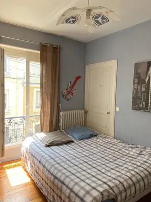 Un ou plusieurs lits dans un hébergement de l'établissement Chambres d’hôtes