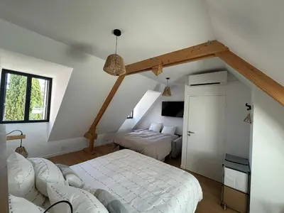 Un ou plusieurs lits dans un hébergement de l'établissement Les chambres d'hôtes du petit bois