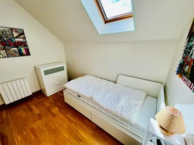 Un ou plusieurs lits dans un hébergement de l'établissement Centre-bourg, calme, familial, l'appart du Clocher