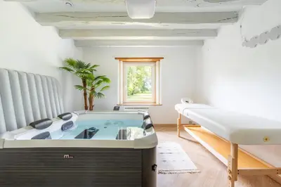 Un ou plusieurs lits dans un hébergement de l'établissement Longère Spa & Bien-être