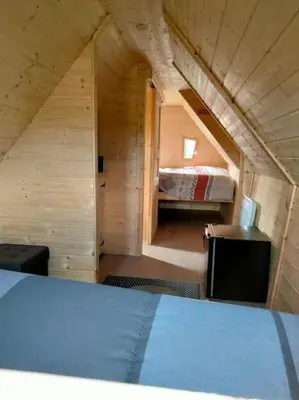Un ou plusieurs lits dans un hébergement de l'établissement Cabane - La Forest