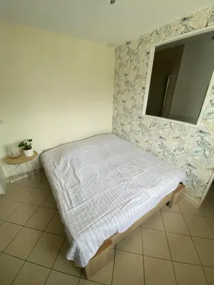 Télévision ou salle de divertissement dans l'établissement L'Oasis
