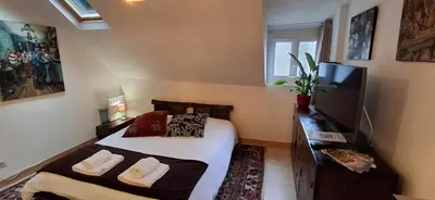 Un ou plusieurs lits dans un hébergement de l'établissement appartement chez Eric 7