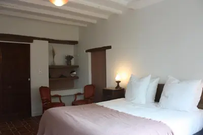 Un ou plusieurs lits dans un hébergement de l'établissement Les Chambres d'Emma
