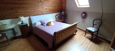 Un ou plusieurs lits dans un hébergement de l'établissement agréables chambres d'hôtes près du centre ville avec jardin