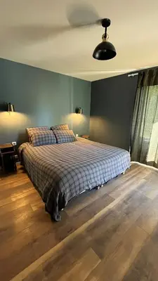 Un ou plusieurs lits dans un hébergement de l'établissement Gîte du Puits Chauveau Spa Vignes Chateaux 8pers