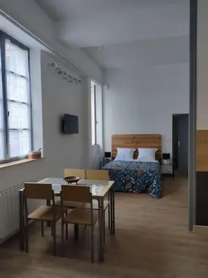 Un ou plusieurs lits dans un hébergement de l'établissement Appartement avec parking privé