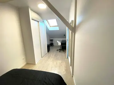 Télévision ou salle de divertissement dans l'établissement Le nid citadin - avec place de parking