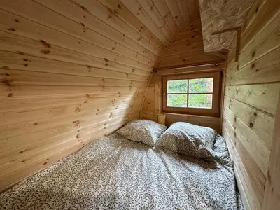 Un ou plusieurs lits dans un hébergement de l'établissement LOGEMENT INSOLITE Pod sur Pilotis