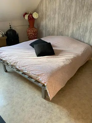 Un ou plusieurs lits dans un hébergement de l'établissement Chambres à louer