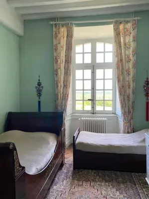Un ou plusieurs lits dans un hébergement de l'établissement Château d'Ardenay sur merize