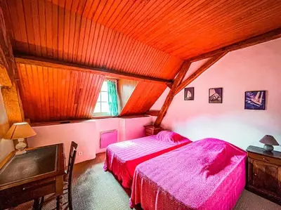 Un ou plusieurs lits dans un hébergement de l'établissement Moulin de la Caluyére