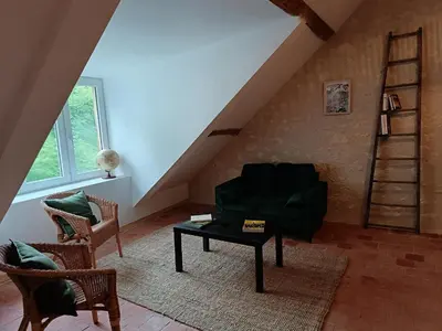 Coin salon dans l'établissement Gîte au milieu des vignes