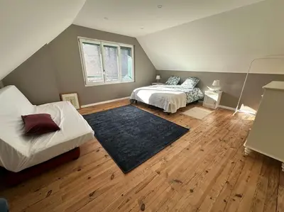 Un ou plusieurs lits dans un hébergement de l'établissement Appartement spacieux en centre ville