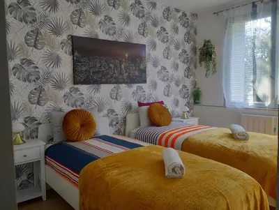 Un ou plusieurs lits dans un hébergement de l'établissement Appartement le Trésor d'amour