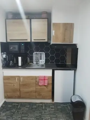 Cuisine ou kitchenette dans l'établissement Studio le Trésor d'amour