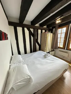 Un ou plusieurs lits dans un hébergement de l'établissement Gîtes Place Plumereau de Tours