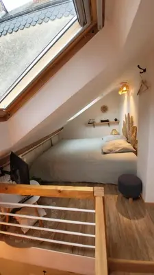 Un ou plusieurs lits dans un hébergement de l'établissement Studio cosy climatisé