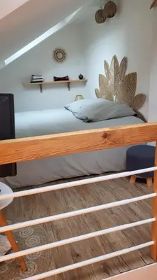 Un ou plusieurs lits dans un hébergement de l'établissement Studio cosy climatisé