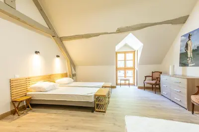 Un ou plusieurs lits dans un hébergement de l'établissement Château de Conon - Gîte la Cоncіergerіe