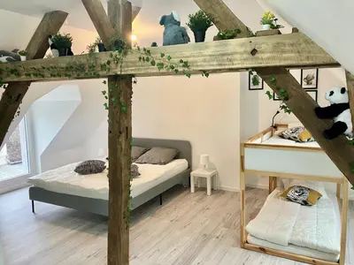 Un ou plusieurs lits dans un hébergement de l'établissement Gite de nounours à beauval